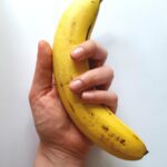 yellow banana on hand