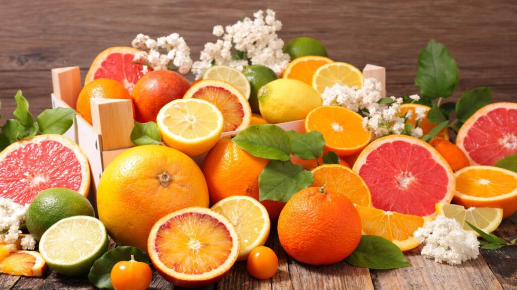 a group of oranges and lemons