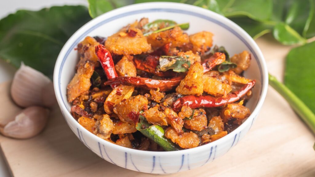 a bowl of food with red peppers